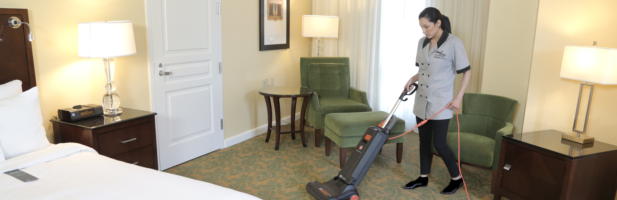 a woman standing in a hotel room