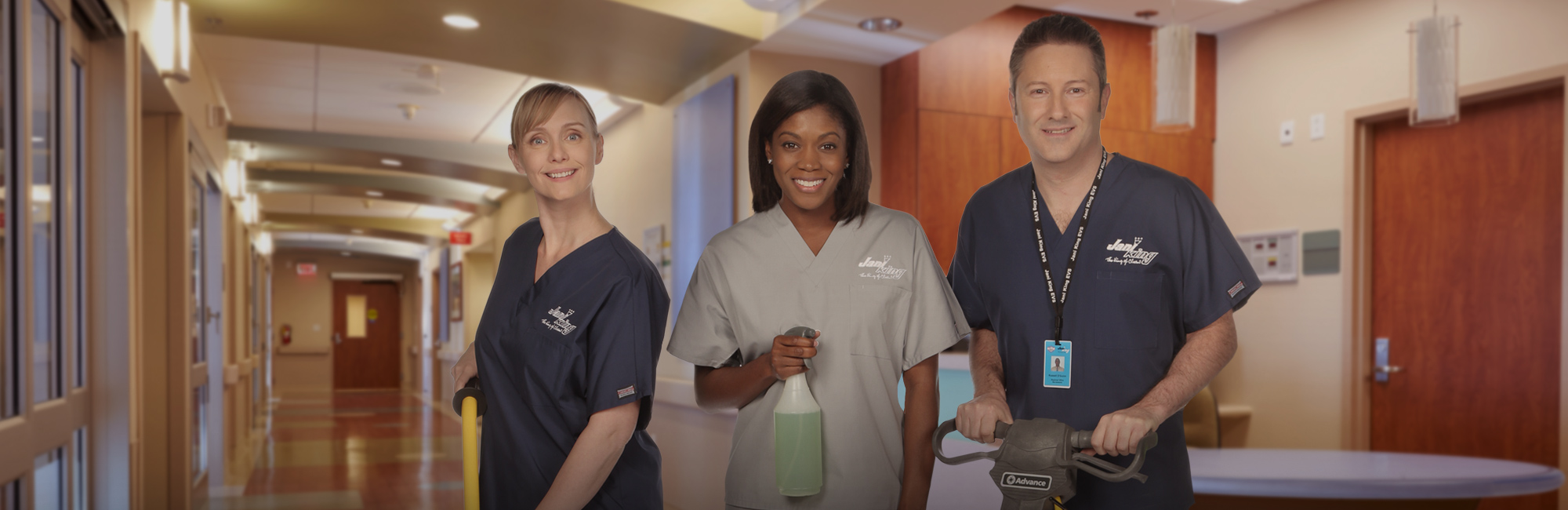 a man and woman in scrubs standing in a hospital hallway