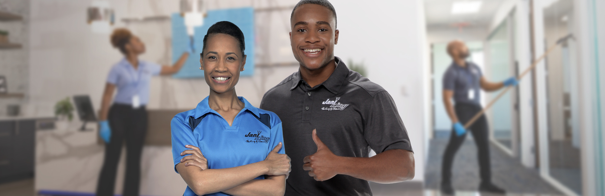 a man and woman in scrubs standing in a hospital hallway
