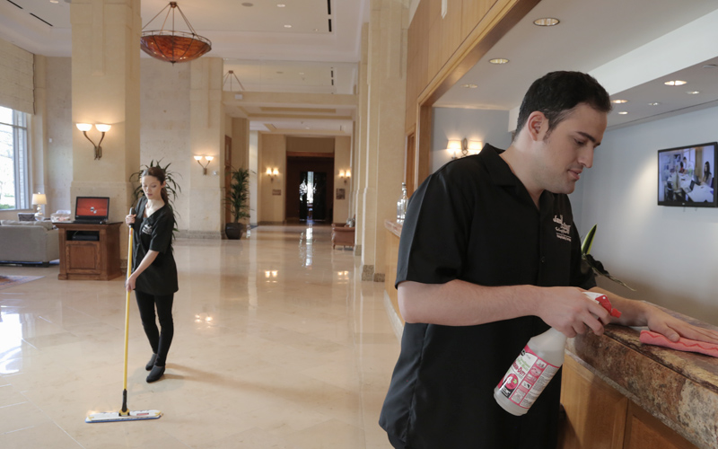 a man cleaning a hotel lobby