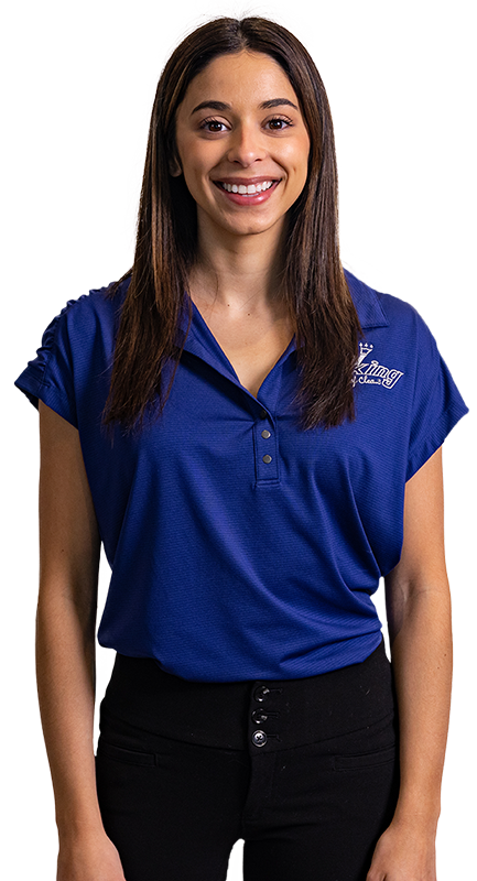 a woman in a blue shirt and black pants