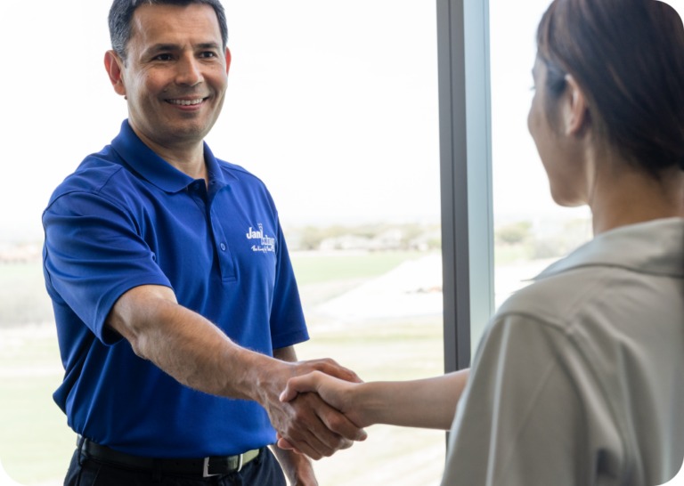 a man shaking hands with a woman