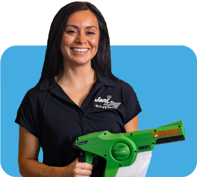 a woman holding a green and white blower a woman holding a green and white blower providing building cleaning services
