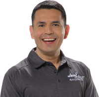 a man in a black shirt smiling a man in a black shirt smiling