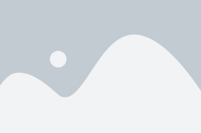 a white mountain with a gray sky in the background